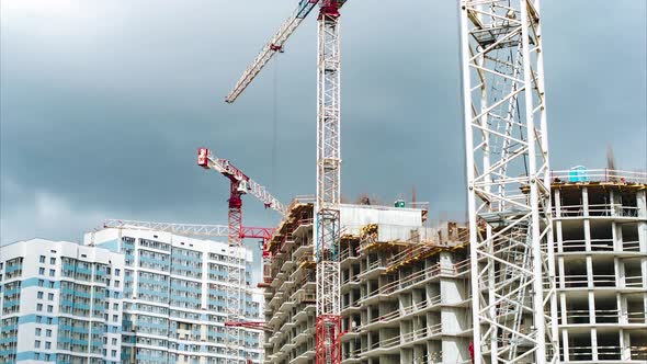 Tall Tower Cranes Operate Constructing House Upper Floors