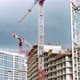 Tall Tower Cranes Operate Constructing House Upper Floors - VideoHive Item for Sale