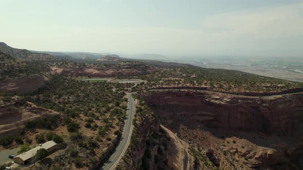 4K Drone Aerial of road on steep cliffs through Colorado National Monument