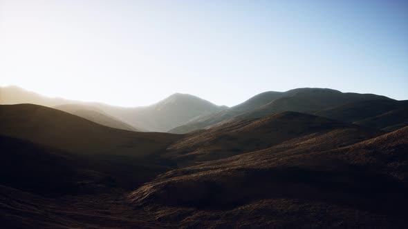 Hills with Rocks at Sunset