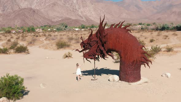 Woman Walking at Gigant Sculpture of Gragon in Anza Borrego Desert