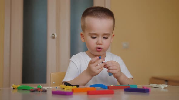 Little Boy Playing Molding Colorful Plasticine Making Toys Sculpting Playdough