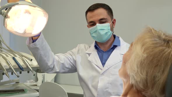 Dentist Begins Check Up of Female Patient