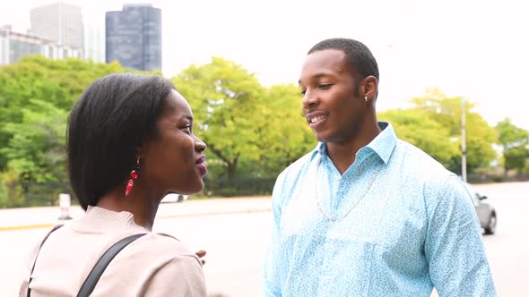 Happy black couple talking in Chicago