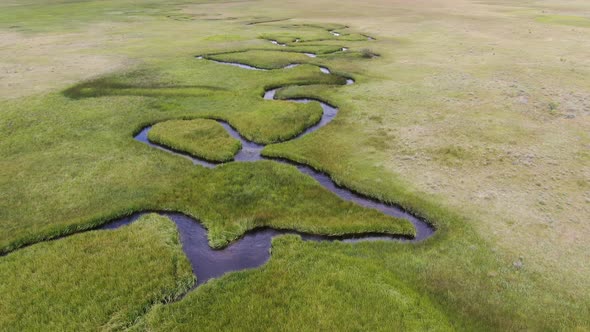 Aerial View of Green Land and Small Curve River in Aspen Springs