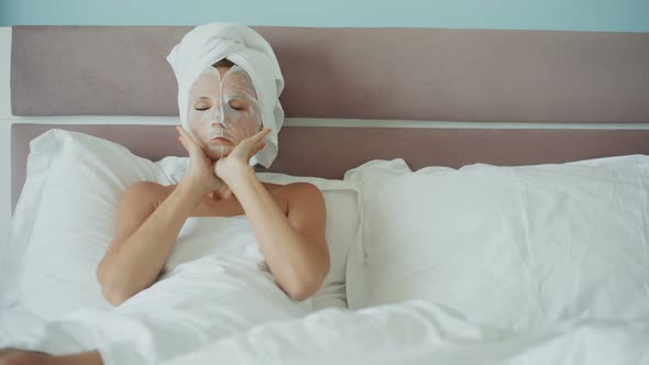 Woman with Paper Cosmetic Mask