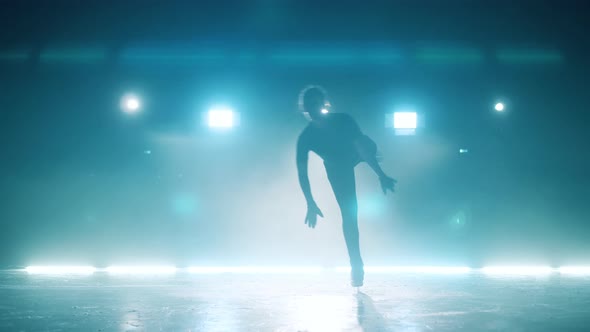 Figure Skater is Spinning in Various Positions During Practice