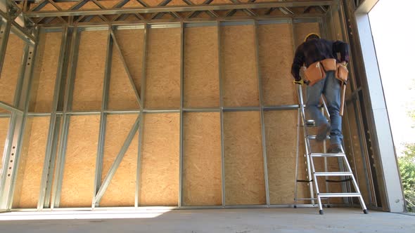 Construction Worker on a Ladder