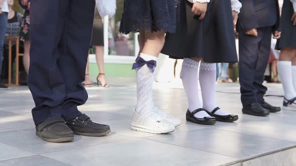 First Graders on a Ruler Near the School