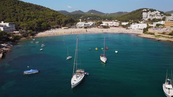 Aerial footage of the Spanish island of Ibiza showing the beautiful beach front and hotels