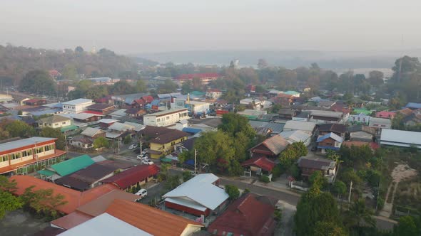 Aerial view of roofs of local village houses. Residential buildings in Ubon Ratchathani,