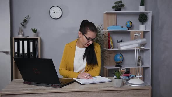 Concentrated Businesswoman in Stylish Jacket Working on Computer at Home