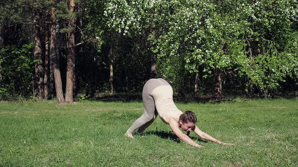 Woman Doing Yoga in Park