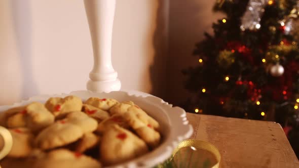 Plate of christmas cookies on wooden table