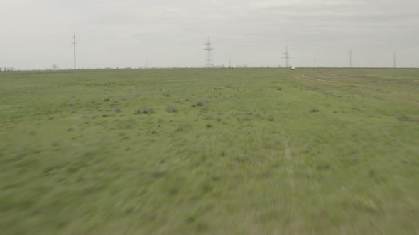 Flying Over an Agricultural Field in Spring