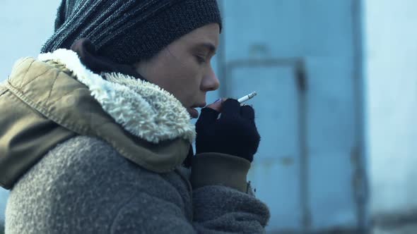 Addicted Homeless Woman Taking Cigarette From Stranger and Smoking Feeling Cold