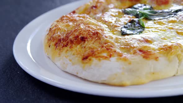 Baked pizza served on plate