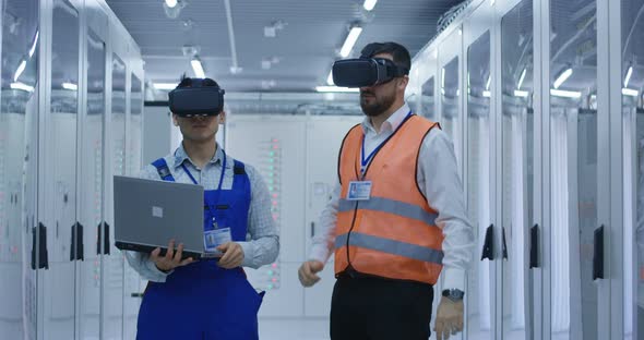 Electrical Workers in Reflective Vests Using VR Headsets