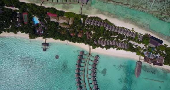 Wide above abstract view of a paradise sunny white sand beach and blue sea background in hi res 4K