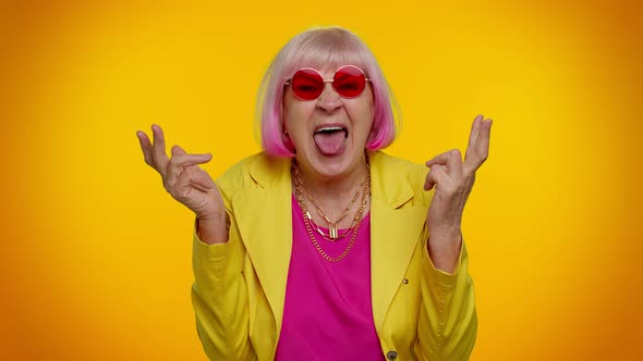 Mature Old Grandma Woman Making Playful Silly Face Expressions Grimacing Fooling Showing Tongue