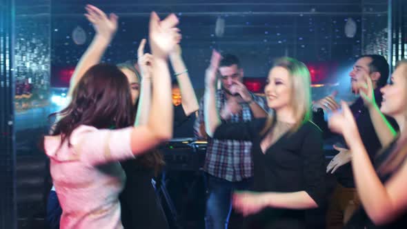 Several Young Women are Dancing at a Party in a Nightclub