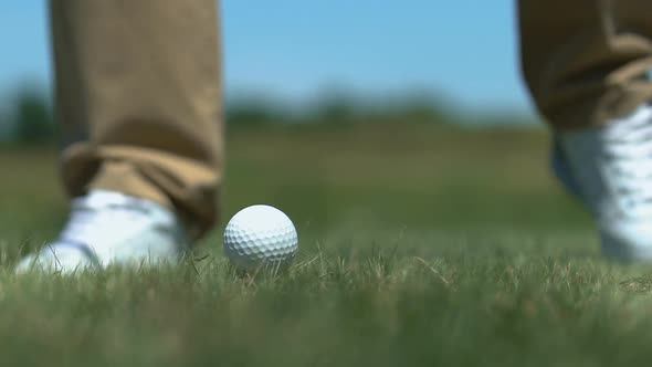 Man Golfer Hitting Ball With Iron Club on Short Distance to Avoid Hazard Closeup
