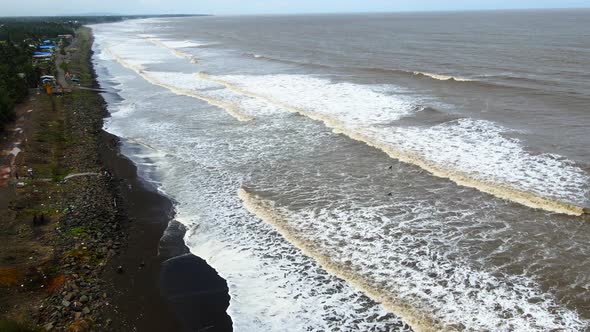 beach at vasi rajodi beach  waves india mumbai maharashtra drone shot india birds eye view  white wa