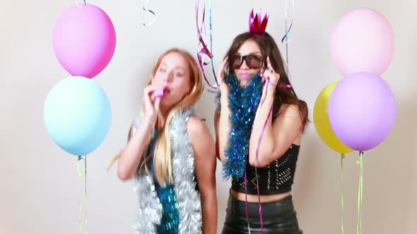 Beautiful girls dancing in photo booth