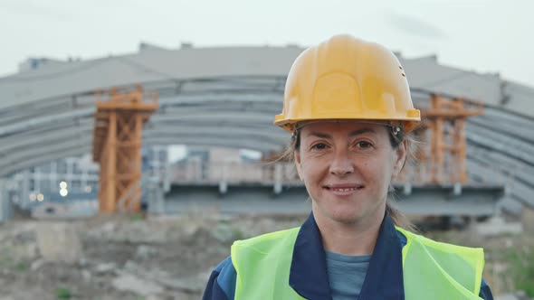 Happy Female Construction Site Worker Posing