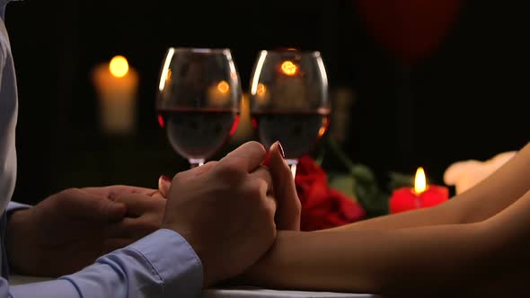 Man Tenderly Holding Female Hands, Stroking Her Fingers, Romantic Date, Flirt