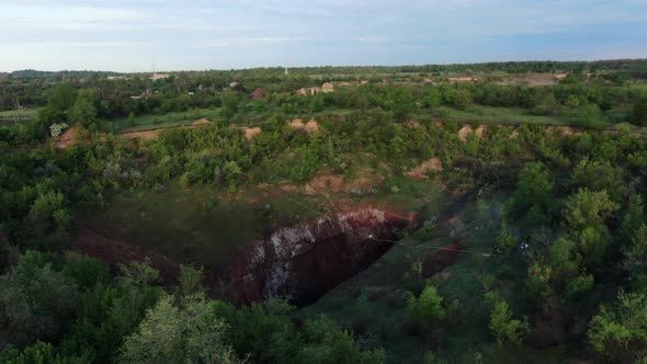 Stunning Aerial View on the Nature and a Huge Pit with a Slackline Stretched
