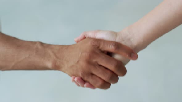 White and Black Hand Connect. Anti-racism. Stop Racism, All People Are Equal. Friendship of Peoples
