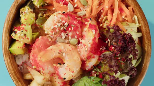 Poke Bowl Salad on Blue Background