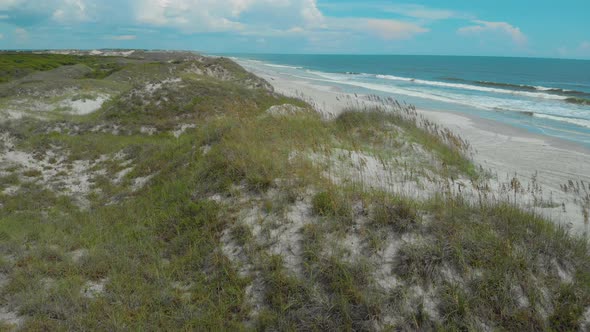 drone shots of the sand dunes and marsh lands at the coast