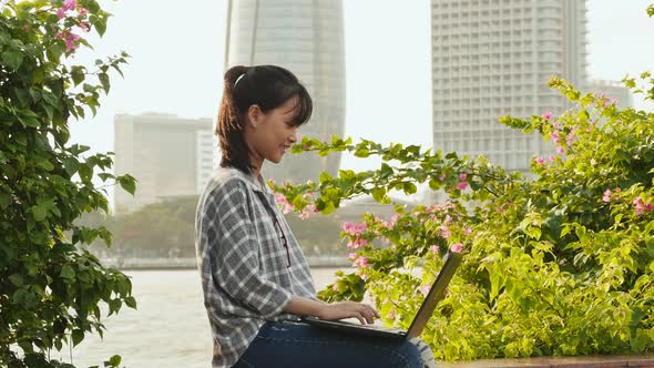 Vietnamese Asian Girl Student Using Laptop in City Center