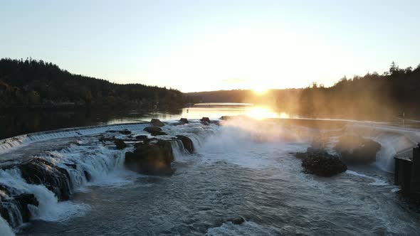 Flying Over Waterfalls with Sunset Behind