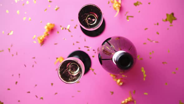 Bottle and Two Glasses Full of Sparkling Champagne Wine with Golden Decoration