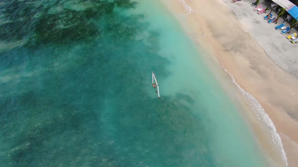 A female tourist swinging in the sea