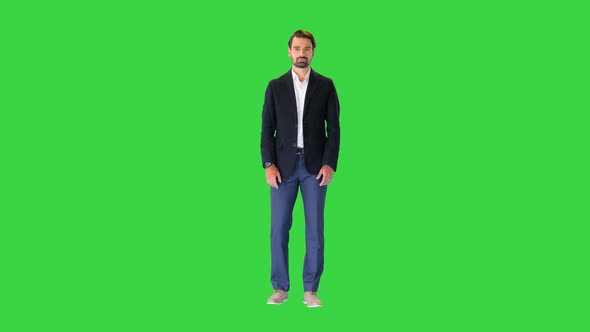 Handsome Man in a Suit Pushing Virtual Buttons Presenting Something on a Green Screen Chroma Key