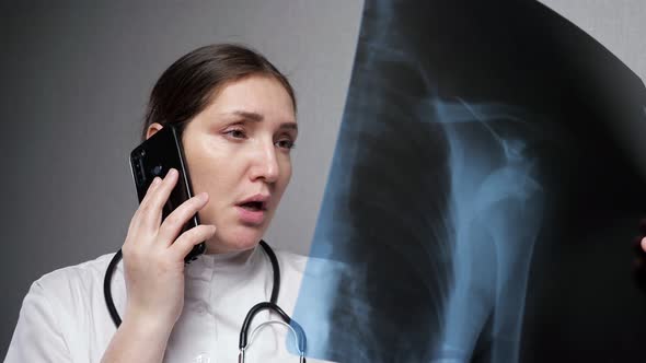 Orthopedist Reports Results of Xray Examination on Phone