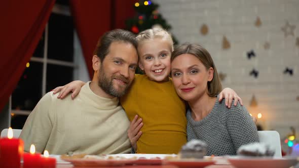 Parents and Girl Looking to Camera