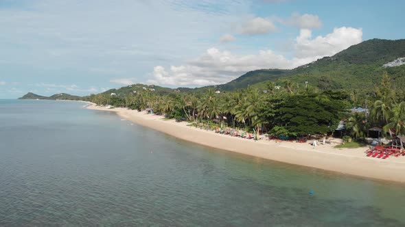 Calm and Serene Beach with Mountains and Palmtrees on Koh Samui Thailand