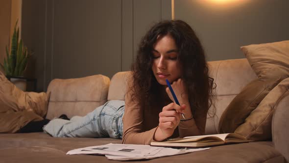 Young Woman Freelancer Does Distance Job at Home Studies Literature Learns Foreign Language Writes