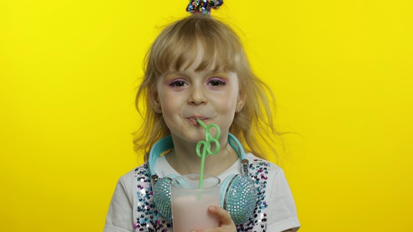 Stylish Happy Child with Milk Cocktail. Tourist Drinking Fresh Beverage Milkshake Drink Using Straw