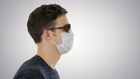 Blind Man Walking in Medical Mask and Dark Glasses on Gradient Background