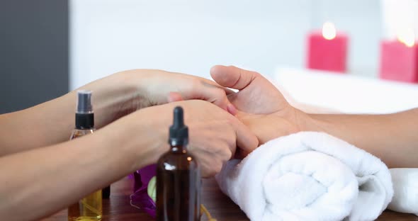 Woman Doing Male Hand Massage in Beauty Salon Closeup  Movie Slow Motion