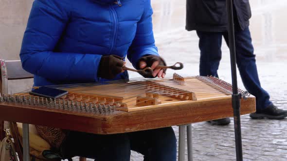 Street Musician Plays a Musical Instrument - Folk Cimbalom