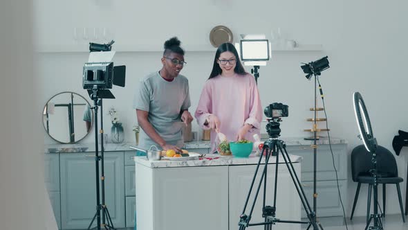 Africanamerican Man and a Lady are Getting Filmed in a Cooking Vlog