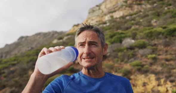 Man exercising outdoors taking a break