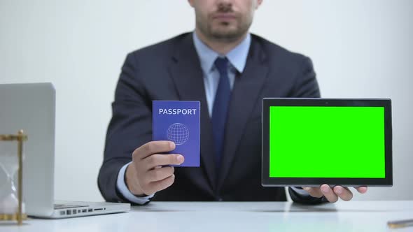 Migration Agent Holding Passport and Tablet, Tourist Visa Application Online